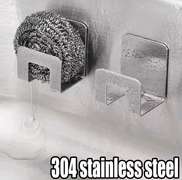 two stainless steel sponge holders with self-adhesive backing mounted on kitchen sink